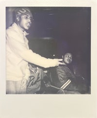 polaroid photo of a man and a woman