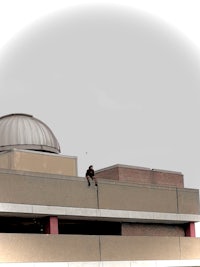 a person is riding a skateboard on the side of a building