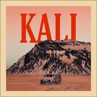 the cover of kali with a truck in front of a mountain