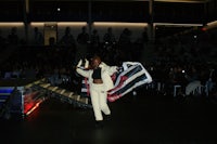 a woman walking on a runway